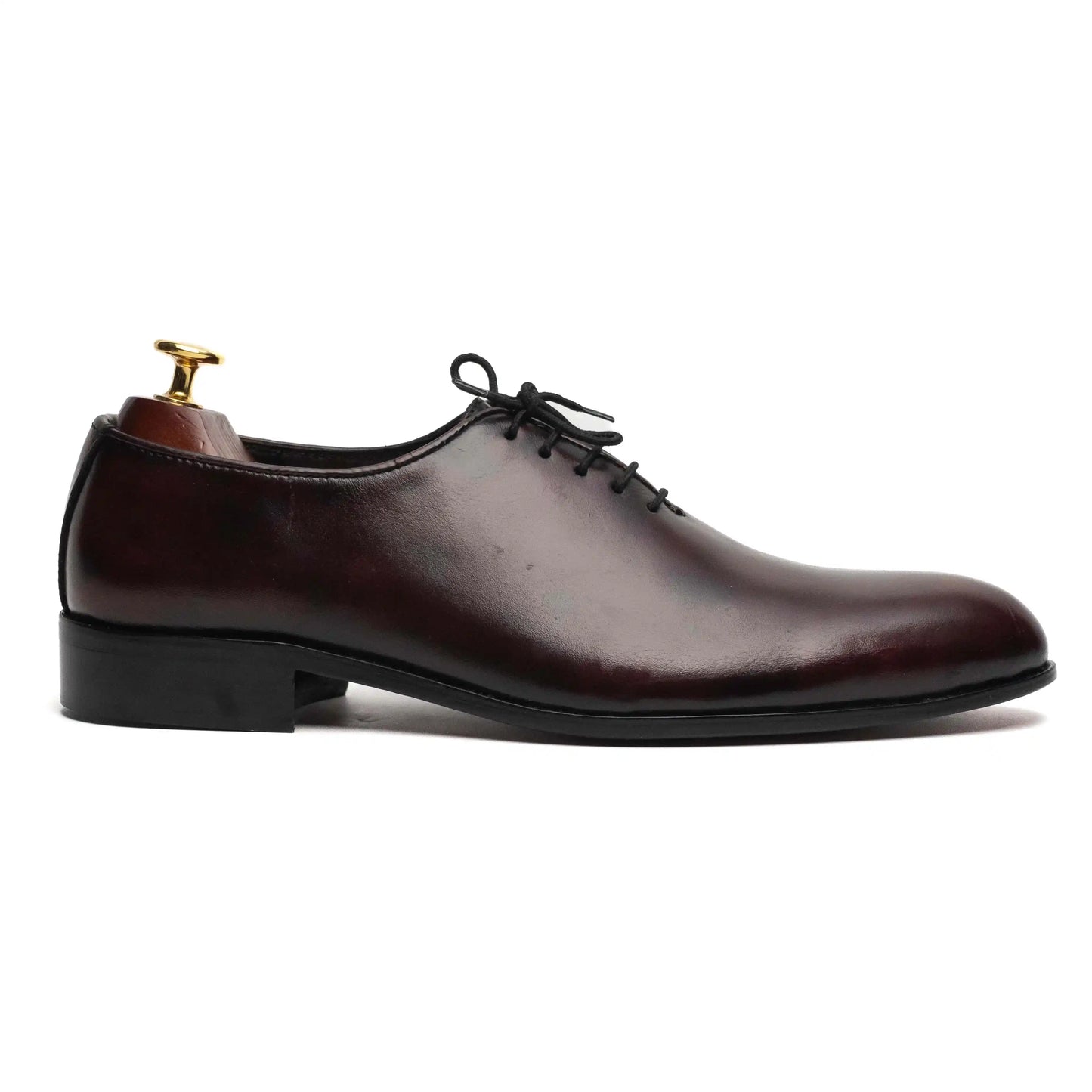 Side angle of Crimson dress shoes, highlighting premium leather craftsmanship and a classic silhouette for a timeless appeal.