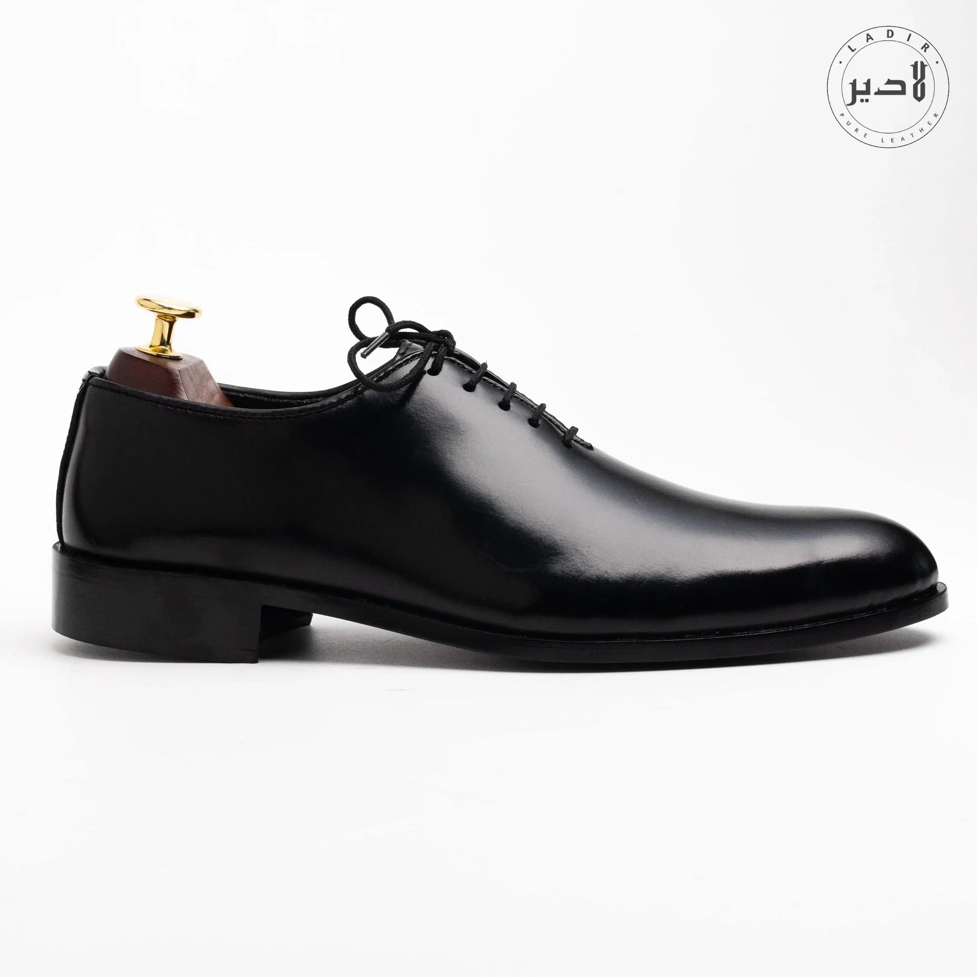 Side angle of OXY BLACK dress shoes, highlighting premium leather craftsmanship and durable stitching, perfect for modern men.